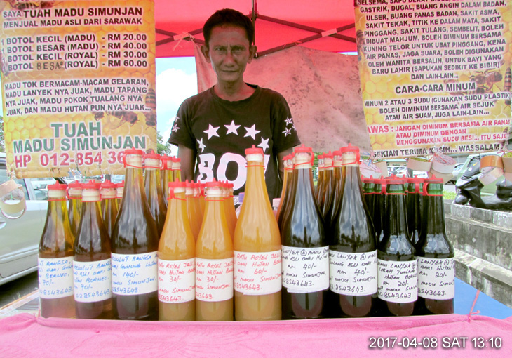 Wild honey seller near Medan Niaga Satok Complex