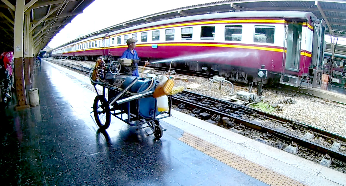 Washing Trains manually at Hualamphong Railway Station Bangkok Thailand